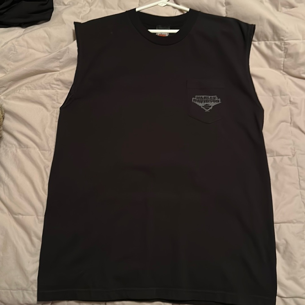 Sleeveless tee, heavy material. It’s large for an XL